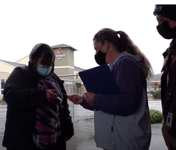 Arcata House Partnership employees welcome a new guest to the Grove